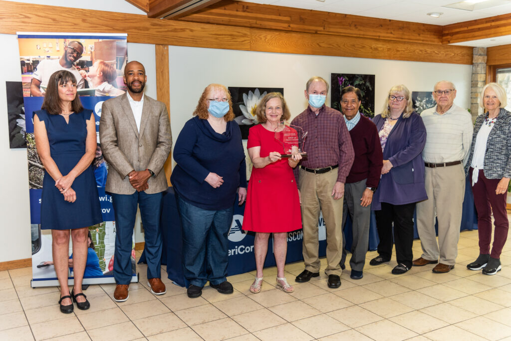 A group of people posing together after they received the Governors Service Award