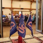 America 250 flags in a vase on a table